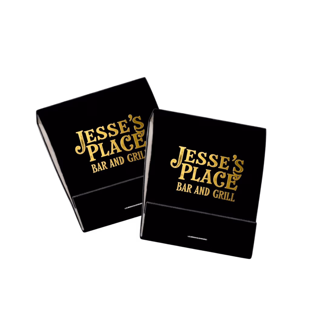 two black custom matchbooks with gold foil printed logos